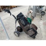 AN ELECTRIC POWAKADDY GOLF TROLLEY WITH A BATTERY AND CHARGER IN GOOD WORKING ORDER BUT NO WARRANTY.