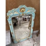 A DECORATIVE FRAMED WALL MIRROR