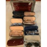 AN ASSORTMENT OF GLASSES AND GLASSES CASES