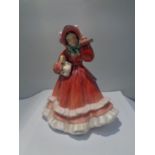 A ROYAL DOULTON FIGURINE CHRISTMAS TIME HN2110