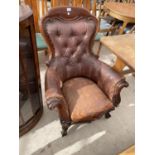 A VICTORIAN MAHOGANY SPOON BACK FIRESIDE CHAIR WITH BUTTON BACK