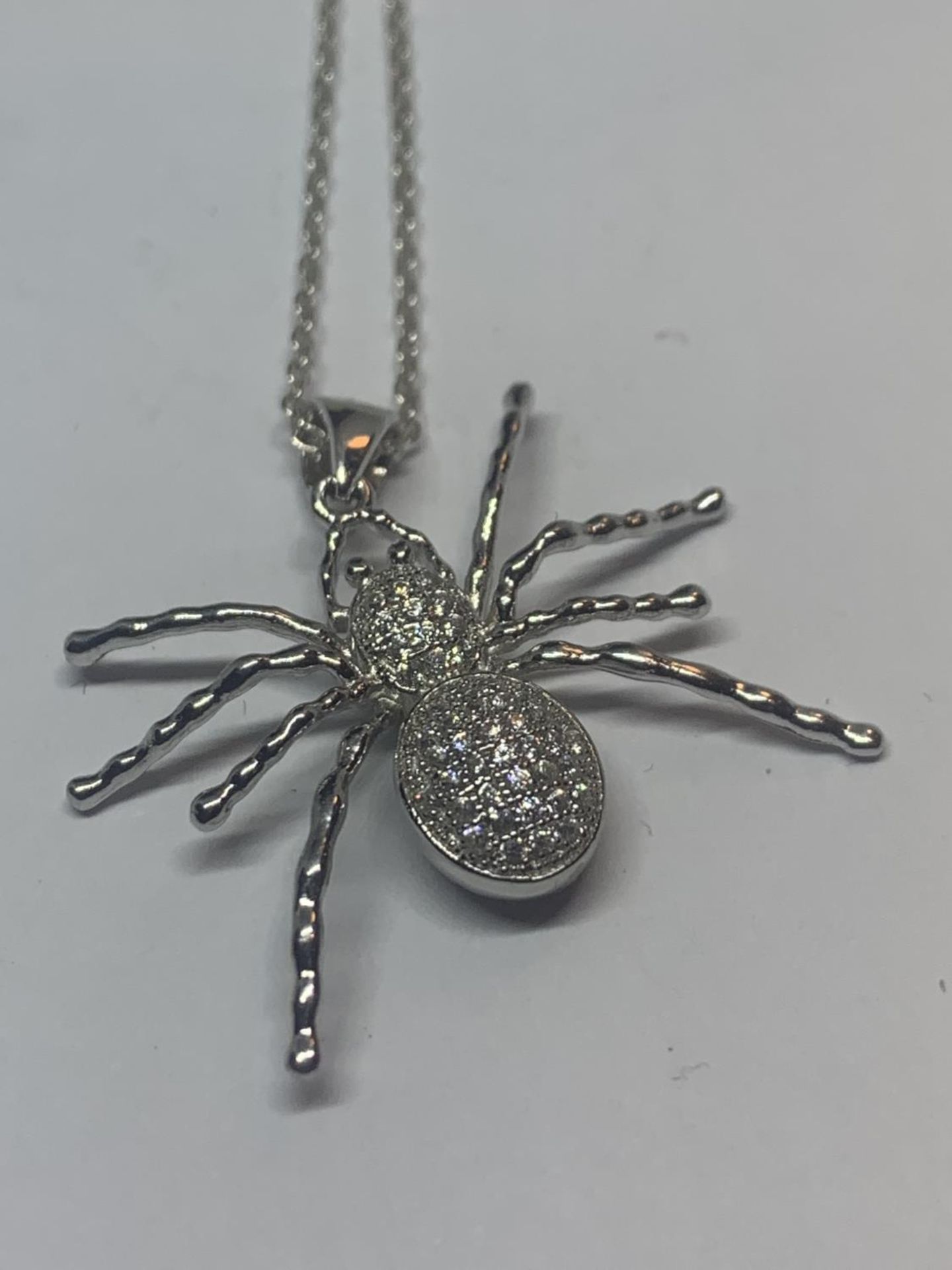 THREE SILVER NECKLACES WITH PENDANTS TO INCLUDE A SPIDER ETC WITH A PRESENTATION BOX - Image 2 of 4