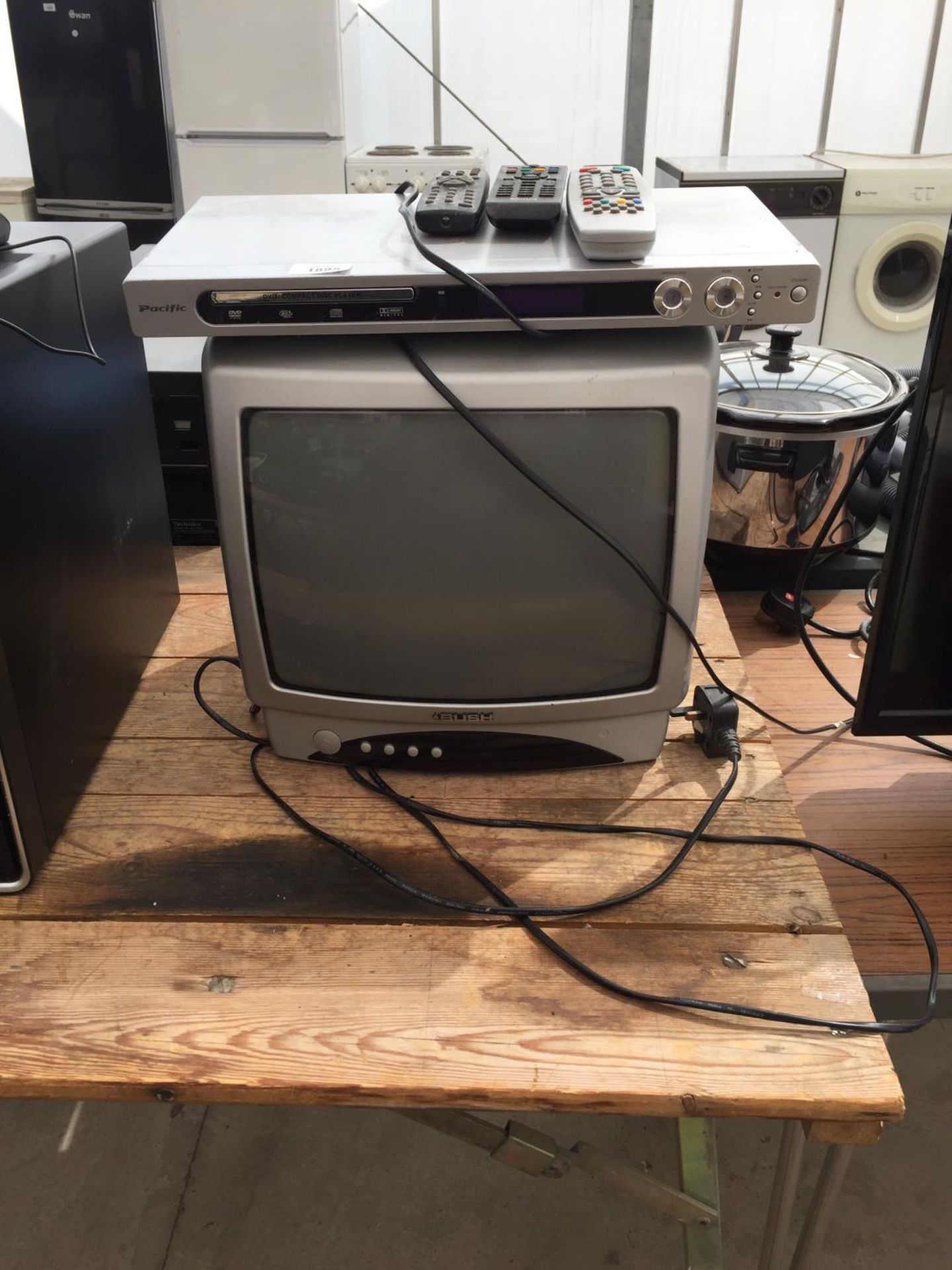 A BUSH TELEVISION AND A PACIFIC DVD PLAYER