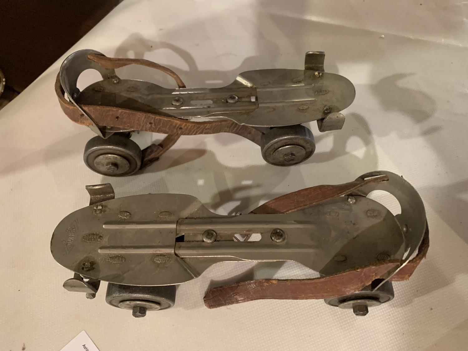 A PAIR OF DAVIES ADJUSTABLE ROLLER SKATES WITH LEATHER STRAPS - Image 2 of 2