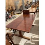 A RETRO EXTENDING HARDWOOD DINING TABLE WITH TWO EXTRA LEAVES