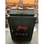 A TRADITIONAL STYLE DARK GREEN POST BOX WITH AN IMAGE OF A TRACTOR