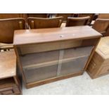 A RETRO TEAK BOOKCASE WITH SLIDING DOORS, 38" WIDE