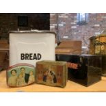 A VINTAGE FIRST AID TIN, ENAMEL BREAD BIN, AND TWO FURTHER TINS