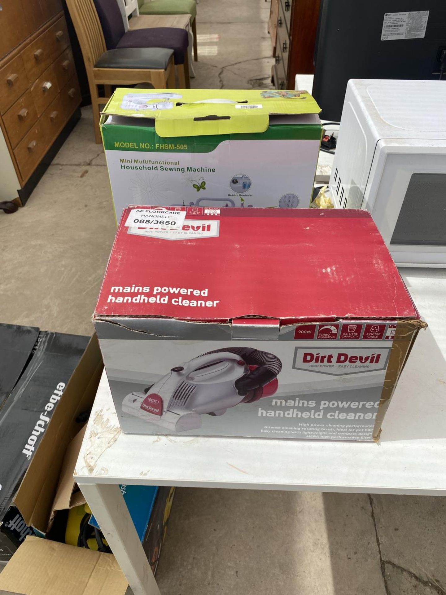 A DIRT DEVIL VACUUM CLEANER AND A FURTHER SEWING MACHINE