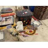AN ASSORTMENT OF ITEMS TO INCLUDE JUGS, WOODEN SPOONS AND A BREAD BIN ETC