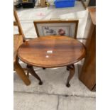 AN OVAL WALNUT OCCASIONAL TABLE AND FIRESCREEN