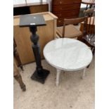 A LOW LLOYD LOOM TABLE, 27" DIAMETER, WITH GLASS TOP AND EBONISED JARDINIER STAND