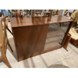 A GIBBS RETRO MAHOGANY BOOKCASE WITH TWO SLIDING DOORS