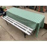 A FORMICA TOPPED TABLE AND THREE SLATTED BENCHES