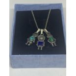 A SILVER NECKLACE WITH THREE ROBOT PENDANTS IN A PRESENTATION BOX
