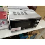 A SILVER MORPHY RICHARDS MICROWAVE OVEN