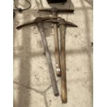 THREE VINTAGE WOODEN HANDLED PICK AXES