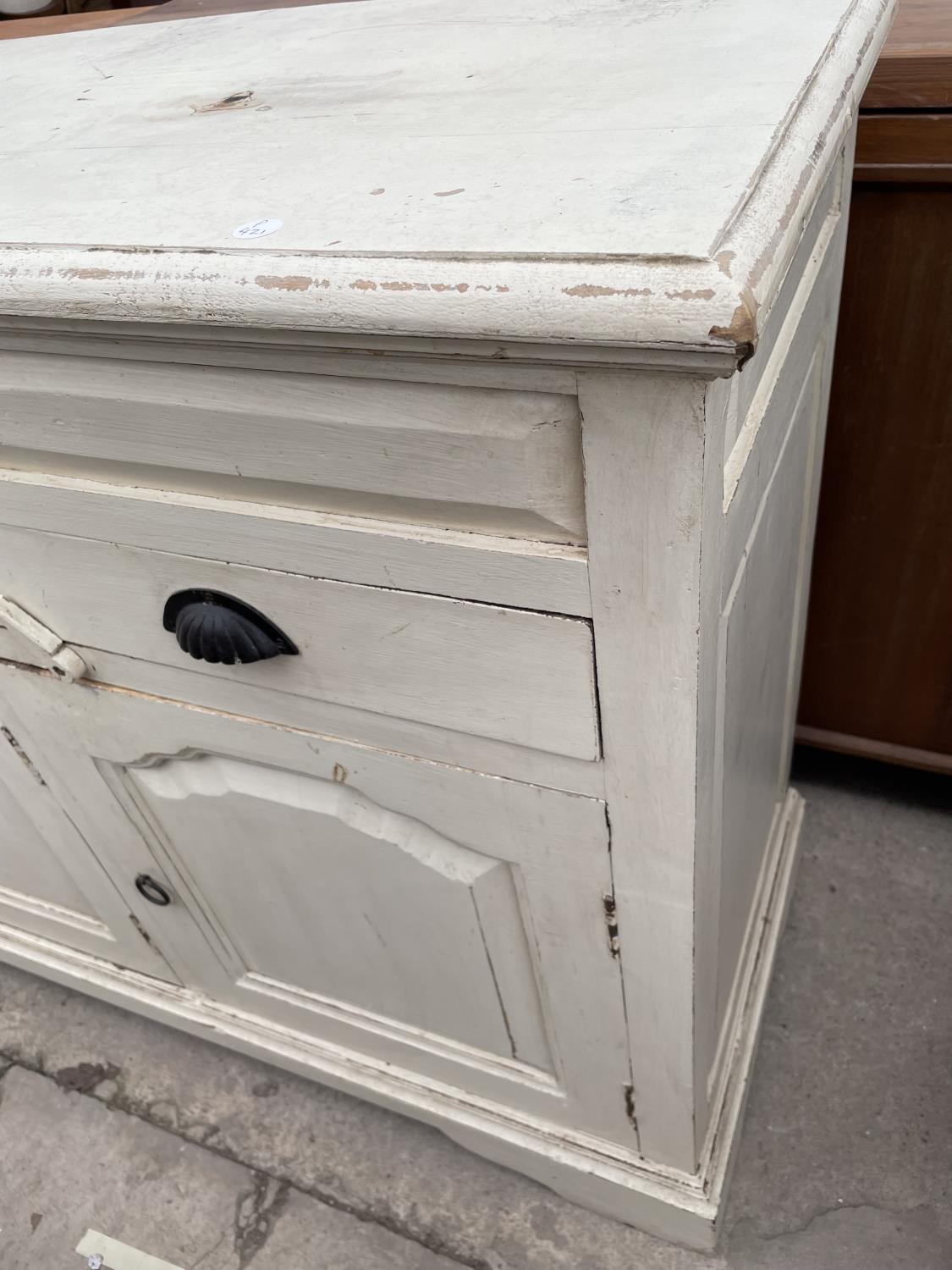 A PAINTED HARDWOOD VICTORIAN STYLE SIDEBOARD, 57" WIDE, ENCLOSING THREE PANELLED DOORS AND THREE - Image 5 of 5