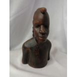 A CARVED HARDWOOD TRIBAL BUST OF A MAN H:27CM