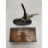 A SIGNED ABSTRACT FIGURINE OF A DANCING COUPLE AND A CARVED LIDDED JEWELLERY BOX