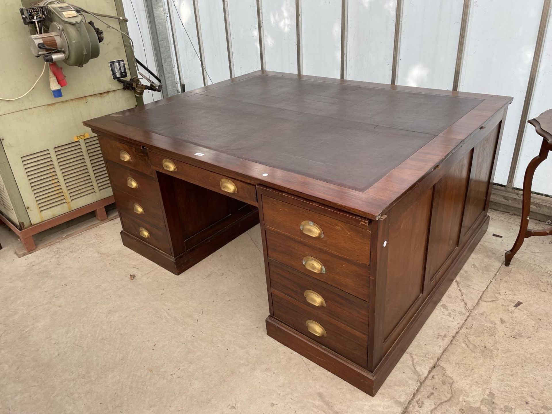 A MID 20TH CENTURY PARTNERS DESK ENCLOSING EIGHTEEN DRAWERS WITH SCOOP HANDLES, FOUR SLIDES, 66X53.