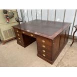 A MID 20TH CENTURY PARTNERS DESK ENCLOSING EIGHTEEN DRAWERS WITH SCOOP HANDLES, FOUR SLIDES, 66X53.