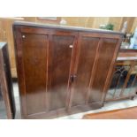 AN EARLY 20TH CENTURY TWO DOOR STORAGE CABINET, 59" WIDE