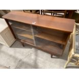 A MID 20TH CENTURY RETRO BOOKCASE WITH GLASS SLIDING DOORS, 43" WIDE