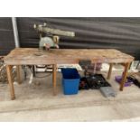 A LARGE INDUSTRIAL WORK BENCH WITH RECORD BENCH VICE AND DEWALT CIRCULAR SAW