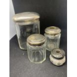 FOUR VARIOUS HALLMARKED SILVER LIDDED GLASS POTS