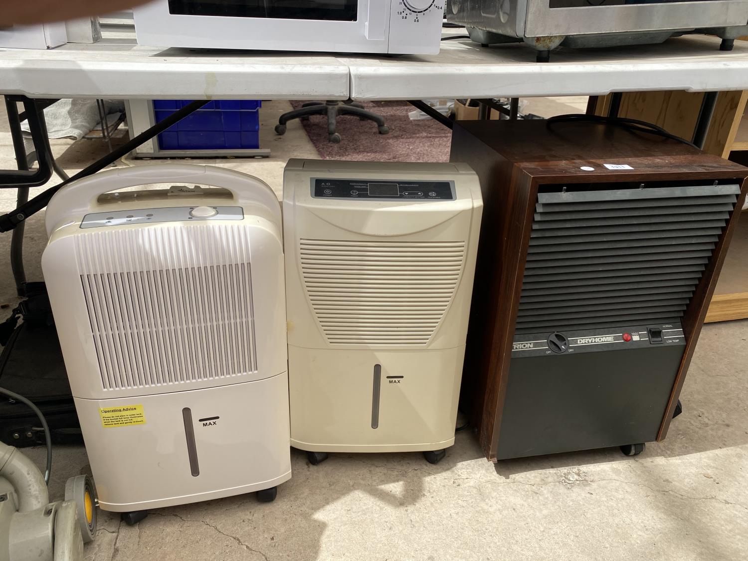 A GROUP OF THREE DEHUMIDIFIERS