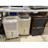 A GROUP OF THREE DEHUMIDIFIERS