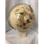 A LARGE GLOBE ON A WOODEN BASE