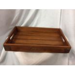 A LANSONS CHAMPAGNE WOODEN DRINKS TRAY. LENGTH 48CM