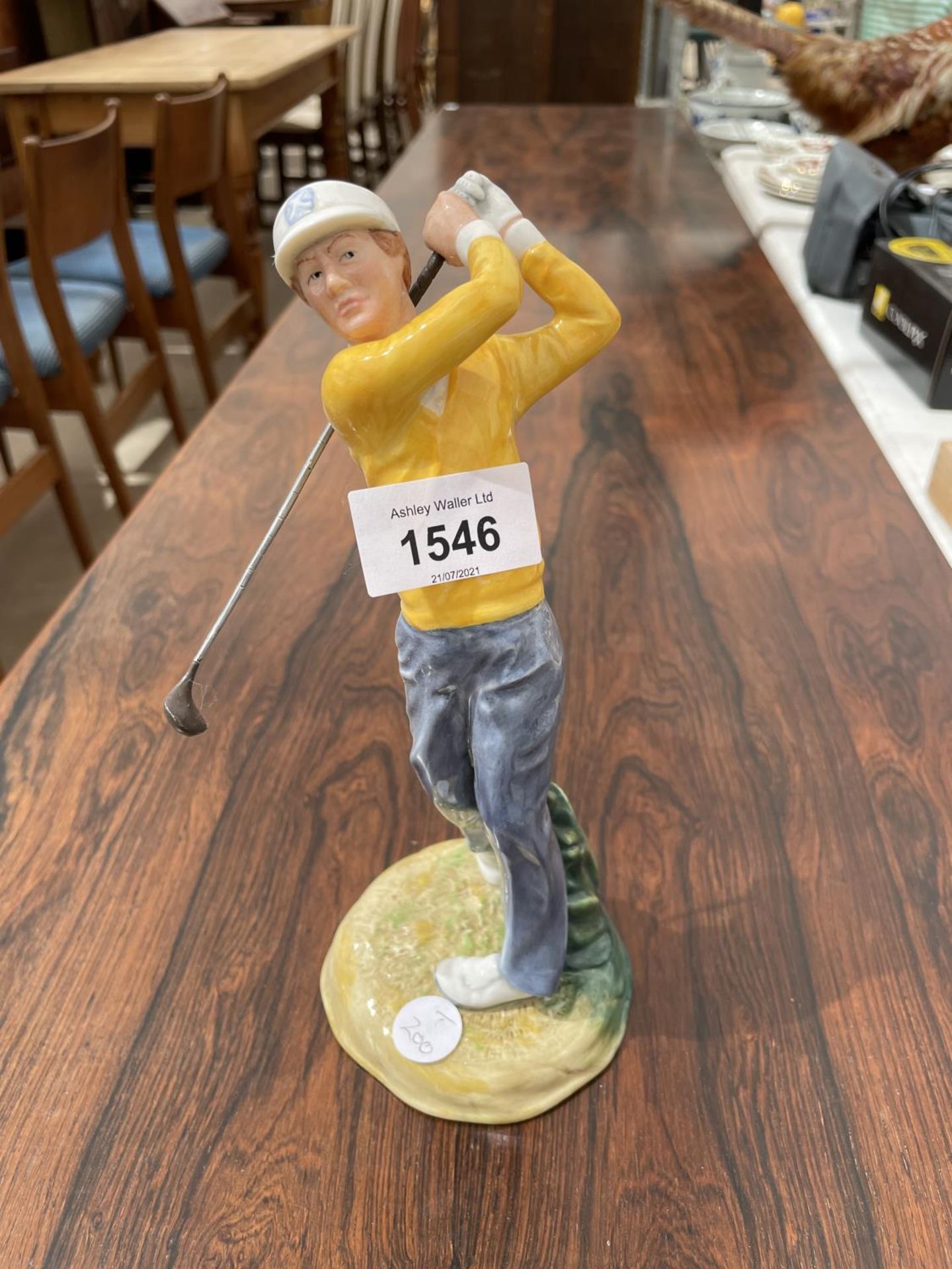 A ROYAL DOULTON GOLF FIGURE 'TEEING OFF'