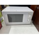 A WHITE SAINSBURYS MICROWAVE OVEN