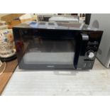 A BLACK AMBIANO MICROWAVE OVEN