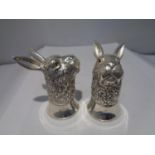 A PAIR OF HEAVY SILVER PLATED HARE DESIGN SALT POTS