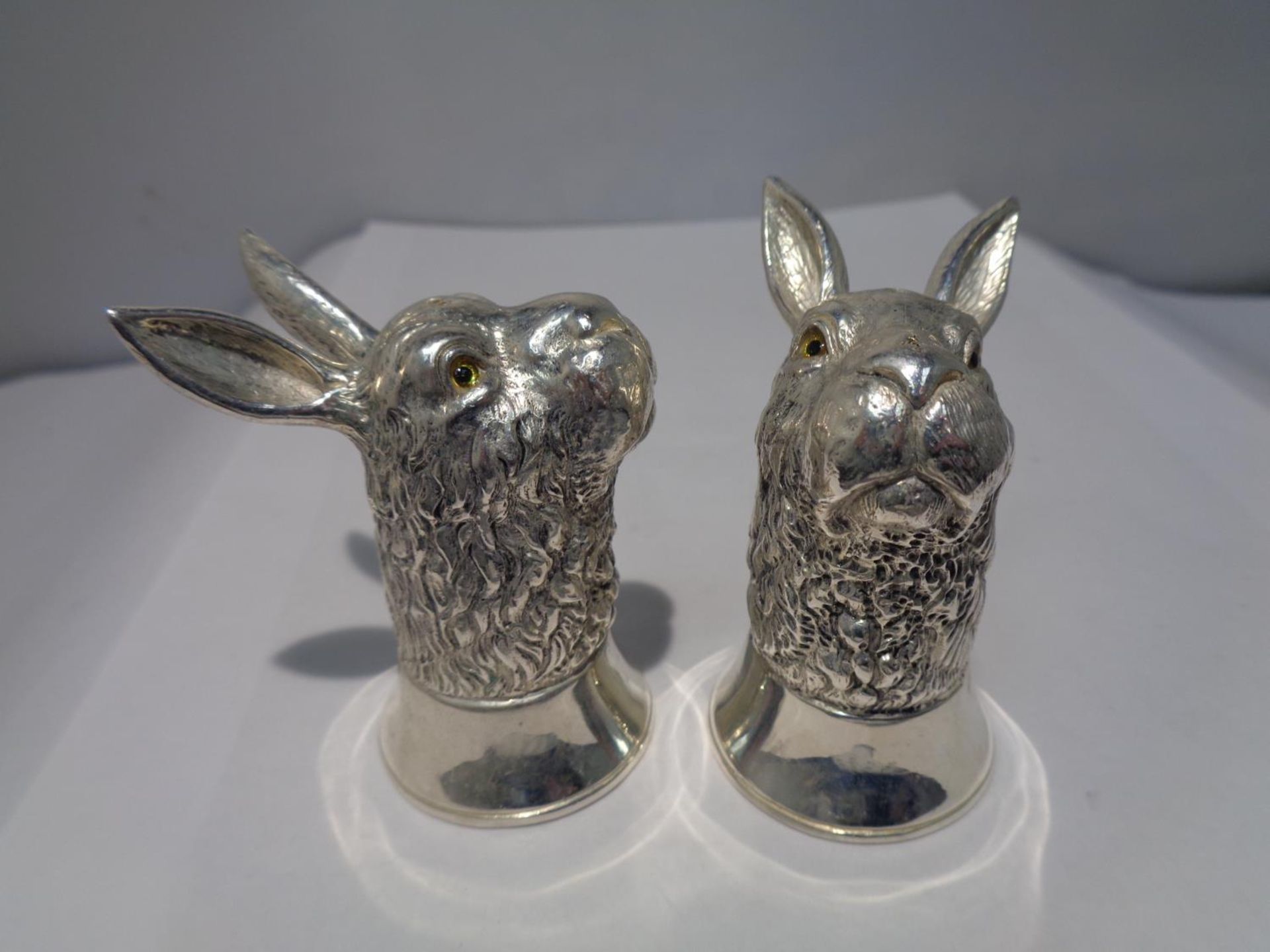 A PAIR OF HEAVY SILVER PLATED HARE DESIGN SALT POTS