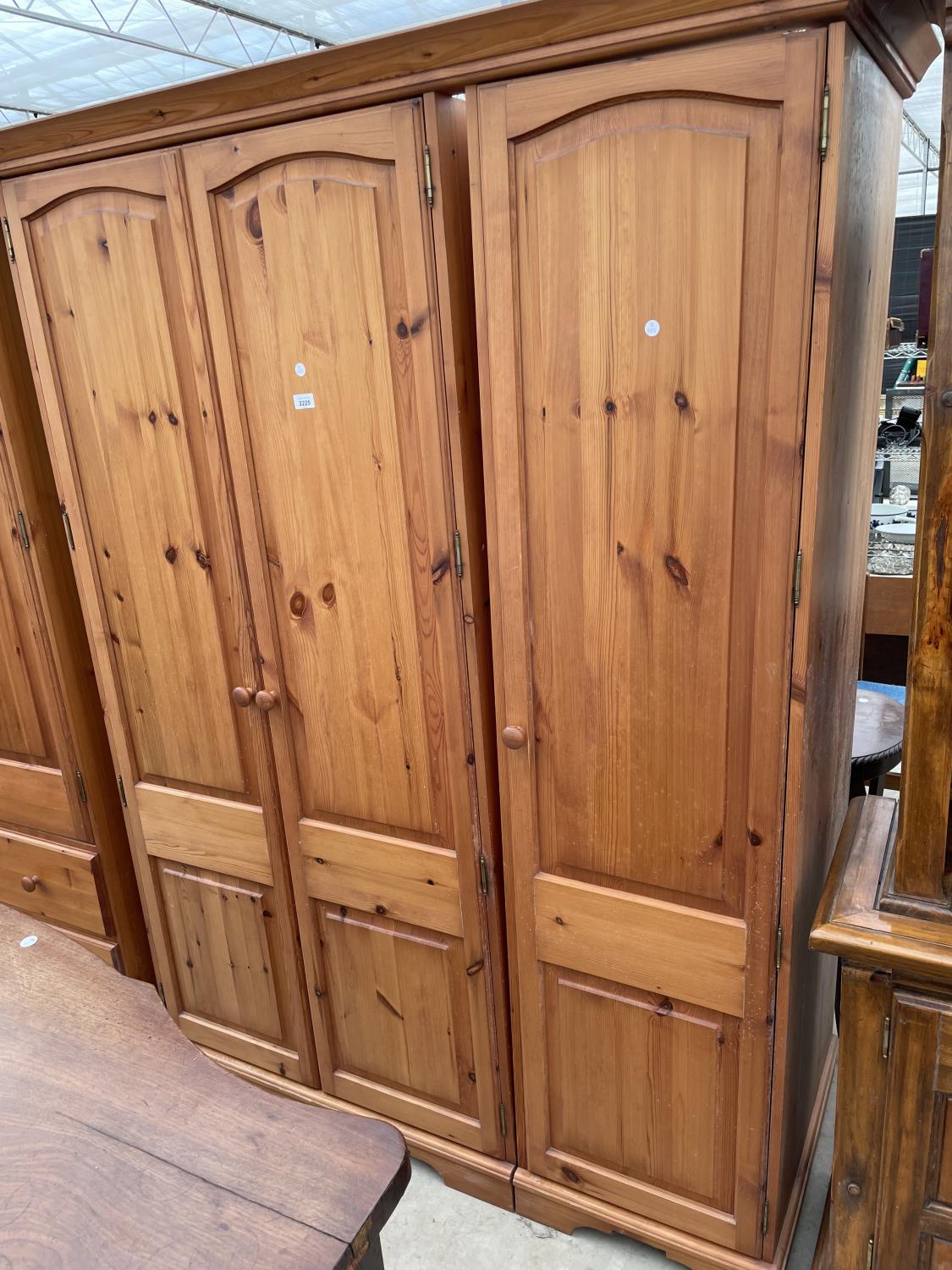 A MODERN THREE DOOR WARDROBE, 58" WIDE, BEARING RELYON LABEL