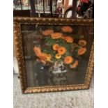 A GILT FRAMED PICTURE OF ORANGE FLOWERS IN A JUG