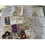 A COLLECTION OF COINS AND BANKNOTES TO INCLUDE CASED SETS AND LOOSE .