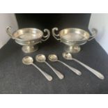 TWO HALLMARKED BIRMINGHAM TWIN HANDLES CUPS WITH FOUR MUSTARD SPOONS