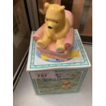 A BOXED ROYAL DOULTON WINNIE-THE-POOH IN ARMCHAIR FIGURE