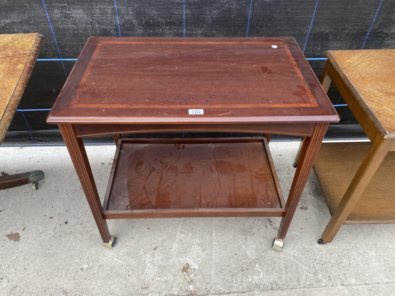 A MAHOGANY AND INLAID TWO TIER TROLLEY