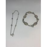 TWO SILVER BRACELETS - ONE CELTIC DESUGN WITH PALE PINK STONES AND ONE WITH VARIOUS COLOURED