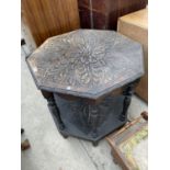 A HEAVILY CARVED VICTORIAN OAK OCTAGONAL TWO TIER OCCASIONAL TABLE