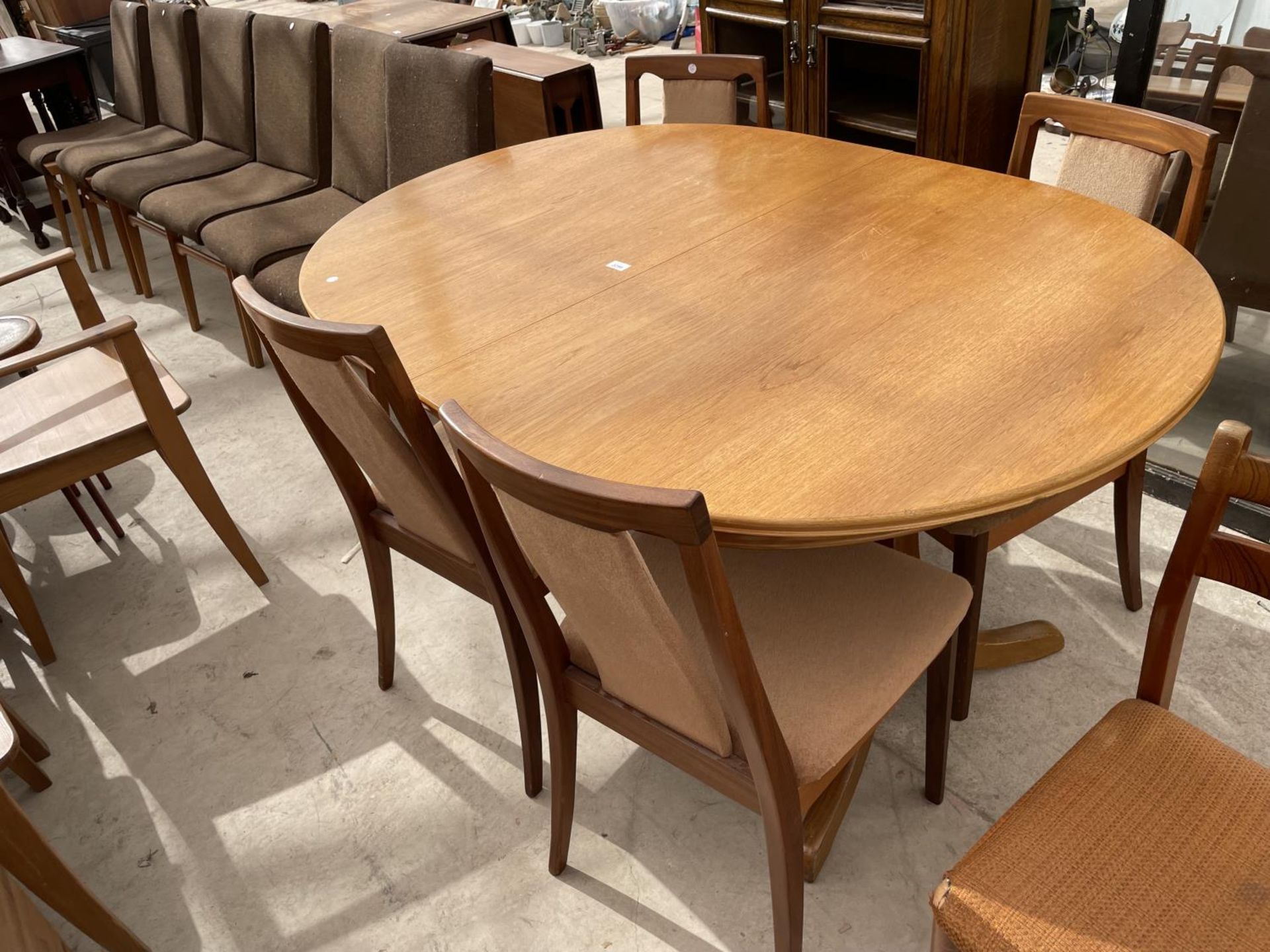 A RETRO TEAK EXTENDING DINING TABLE STAMPED S.FORM (JAMES.H.SUTCLIFFE & SON, LTD) AND FOUR G-PLAN