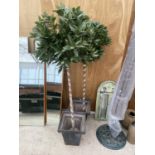 A PAIR OF METAL PLANTERS WITH A PAIR OF ARTIFICIAL BAY TREES