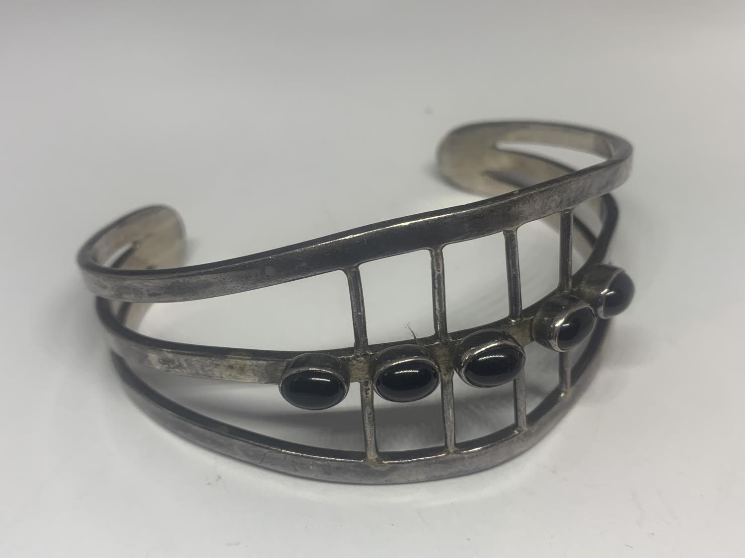 TWO HEAVY SILVER BANGLES WITH BLACK STONES - Image 3 of 3